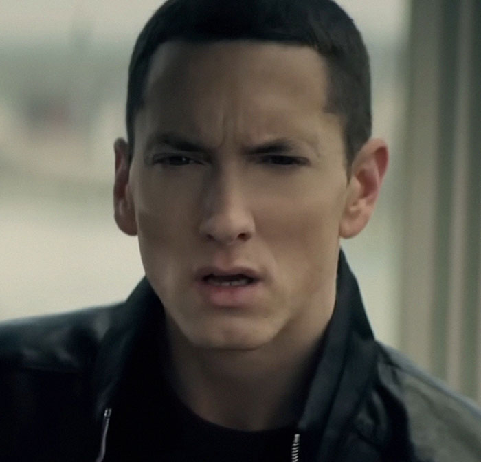 Close-up of a man with a serious expression, related to people who knew celebrities before fame revealing insights.