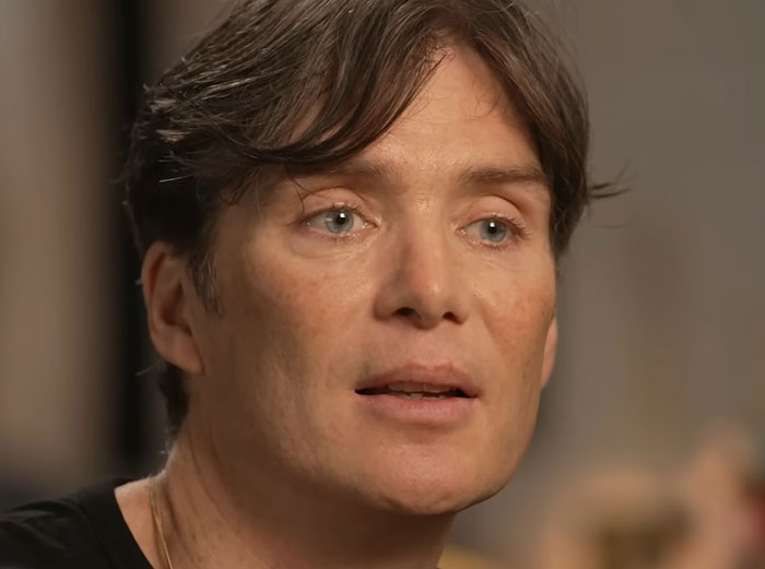 Close-up of a man sharing stories about celebrities before fame in an intimate interview setting.