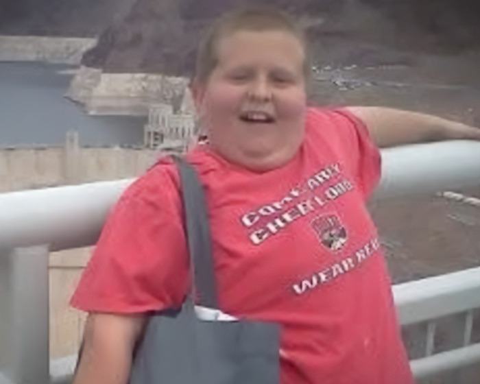 Young man near dam, representing controversial case where man accused mom of incest and became legal father of brother