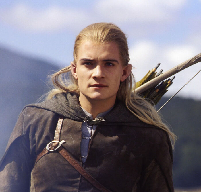 Young man dressed as an archer with long hair and cloak, representing unbelievable facts that were actually true.