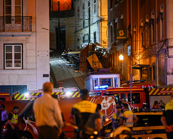 Emergency responders at the scene in Lisbon after a crash where a dad feared lost was found alive with his toddler son rescued.