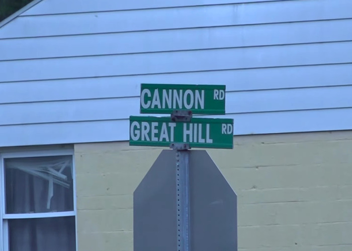 Street signs at Cannon Road and Great Hill Road intersection, related to police solving brutal cold case after 52 years.