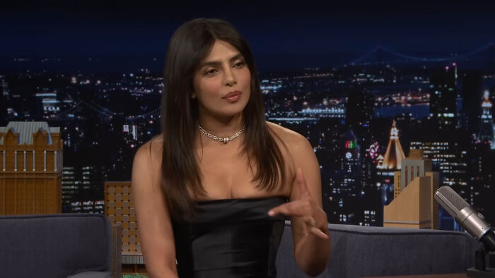 Actress Priyanka Chopra sharing a heartwarming celebrity encounter story during a late-night talk show interview.