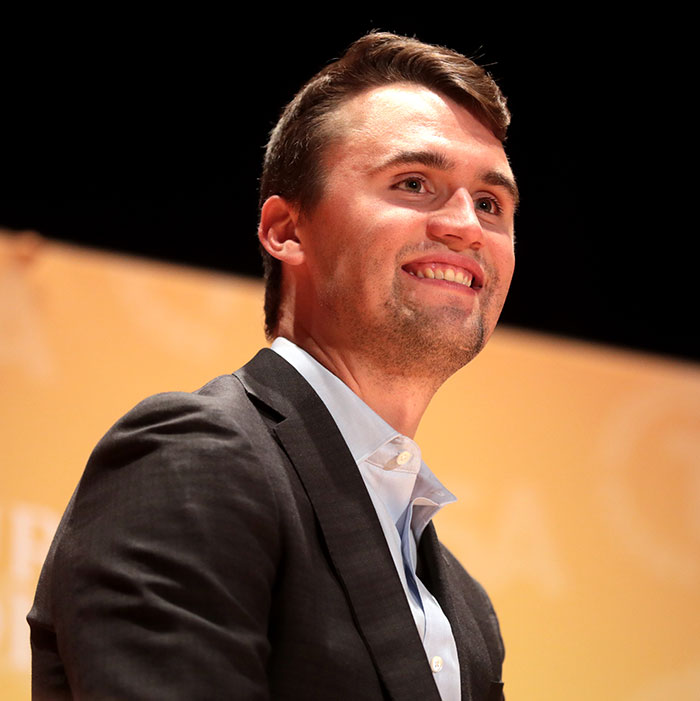 Man in a suit smiling at an event, related to the woman who tanked boyfriend’s career over Charlie Kirk comments story. Man in a suit smiling at an event, related to the woman who tanked boyfriend’s career over Charlie Kirk comments story.