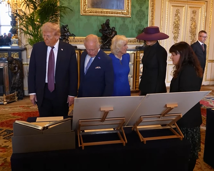 Melania Trump with British Royal Family members in an ornate room, sparking body double conspiracy discussions.