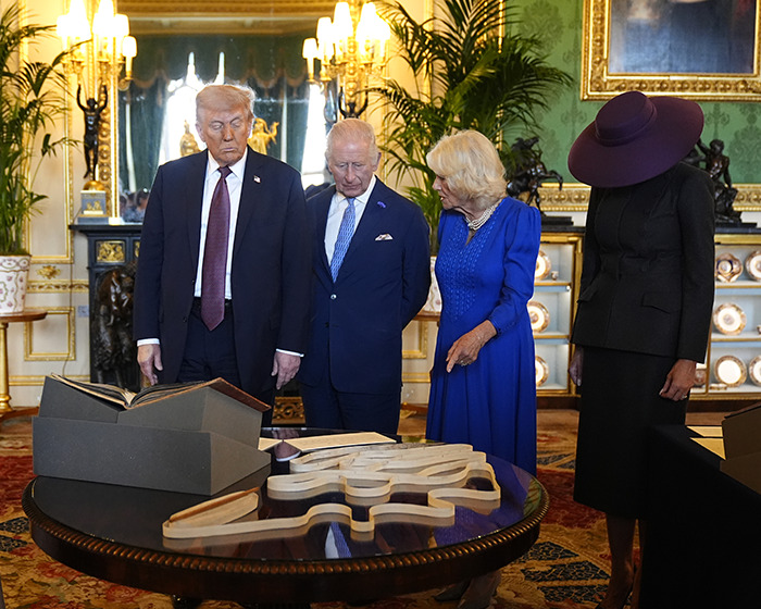 Melania Trump with British royal family members in a formal room, fueling body double conspiracy rumors after viral meeting.