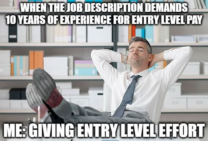 Man in office relaxing with feet up, illustrating a work meme about unrealistic job experience demands.