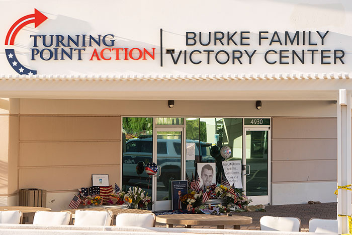 Memorial outside Burke Family Victory Center with flowers and photos during manhunt for Charlie Kirk culprit. Memorial outside Burke Family Victory Center with flowers and photos during manhunt for Charlie Kirk culprit.