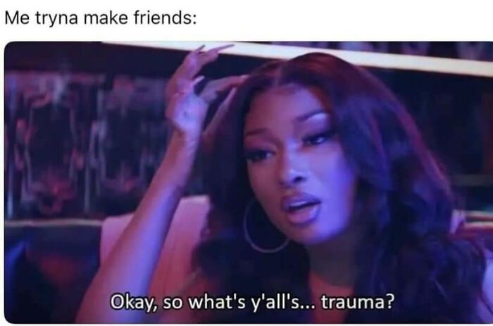 Woman with long hair and hoop earrings asking a question about trauma in a funny mental health meme.