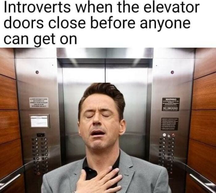 Man in elevator relieved and holding chest, illustrating funny and comforting mental health meme about introverts.