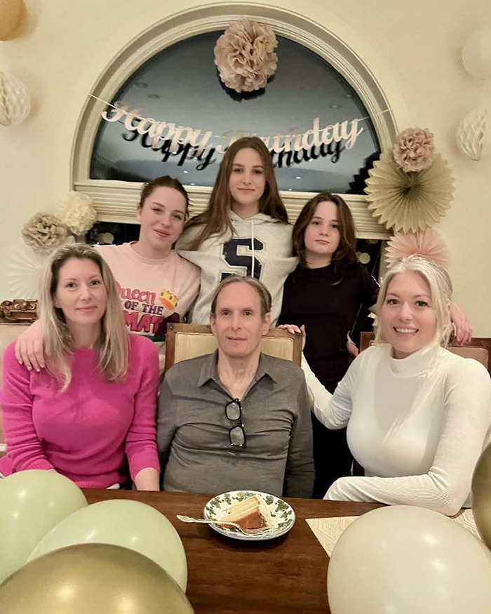 Michael Bolton with family at a birthday celebration, highlighting the weird symptom before his heartbreaking diagnosis.