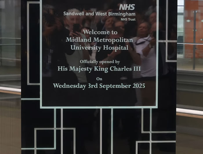 Plaque at Midland Metropolitan University Hospital showing official opening by King Charles with a focus on emotional cancer update.