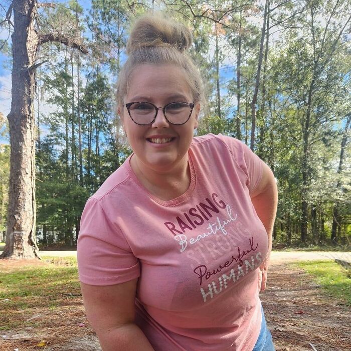 Woman wearing glasses and a pink shirt outdoors in the woods, related to mom of five missing again shortly after being found. Woman wearing glasses and a pink shirt outdoors in the woods, related to mom of five missing again shortly after being found.