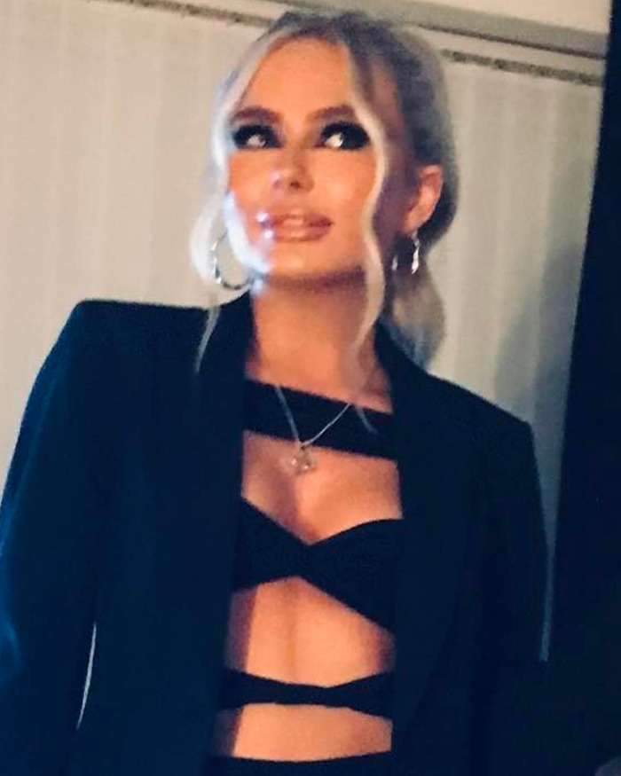 Woman posing in black outfit, representing mom of student jailed for life in Dubai, responding to haters in a bold post. Woman posing in black outfit, representing mom of student jailed for life in Dubai, responding to haters in a bold post.