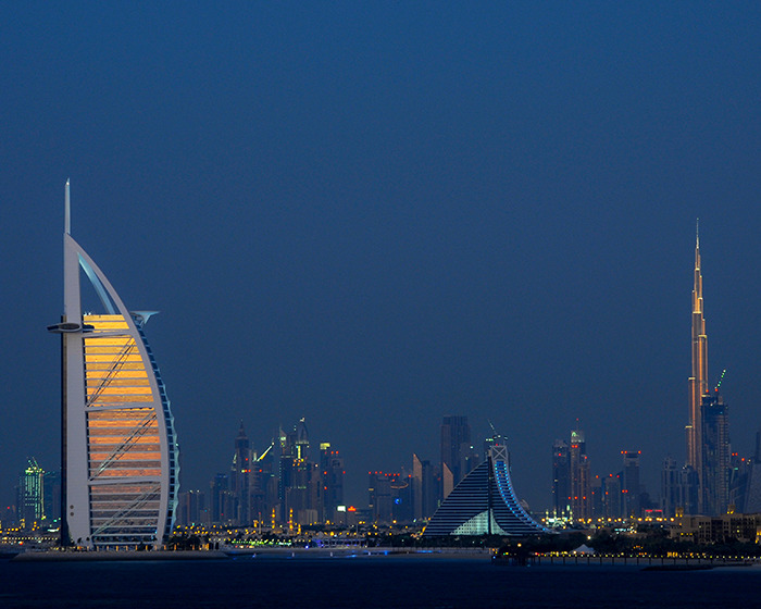 Dubai skyline at dusk with Burj Al Arab and Burj Khalifa lit up, related to student jailed for life in Dubai case. Dubai skyline at dusk with Burj Al Arab and Burj Khalifa lit up, related to student jailed for life in Dubai case.