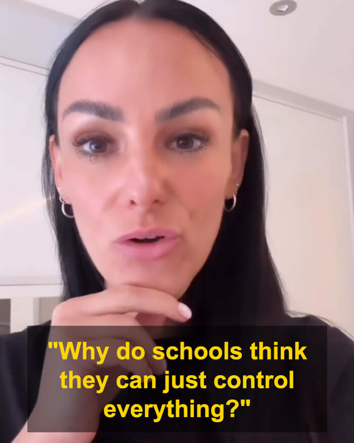 Furious mom expressing frustration after teacher bans son from eating common snack at school in a close-up video.