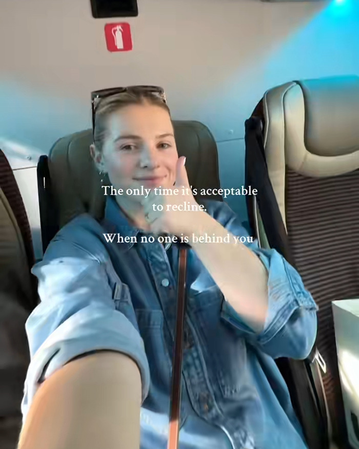 Woman on airplane demonstrating reclining seat with text about acceptable reclining when no one is behind, annoyed mom viral debate. Woman on airplane demonstrating reclining seat with text about acceptable reclining when no one is behind, annoyed mom viral debate.
