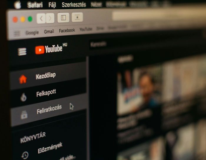 YouTube homepage on a computer screen showing video thumbnails and navigation in Hungarian language.