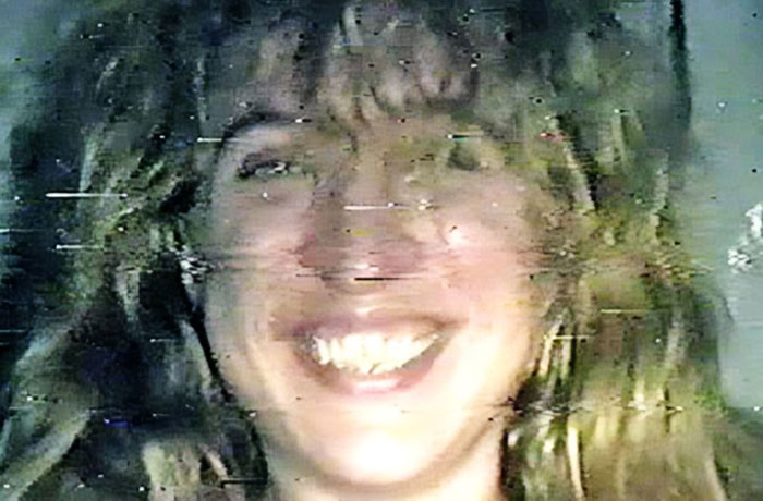 Woman’s distorted smiling face underwater revealing mysterious visual effects in an unusual photo with hidden meanings.
