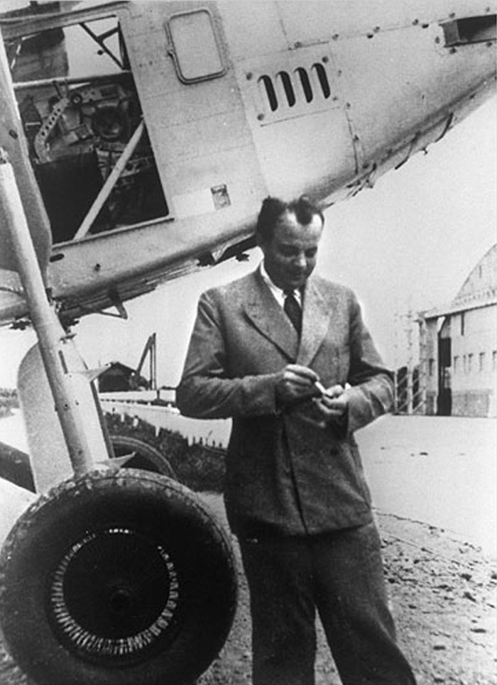 Black and white image of a man standing by an airplane, linked to celebrities who vanished without a trace and conspiracy theories.