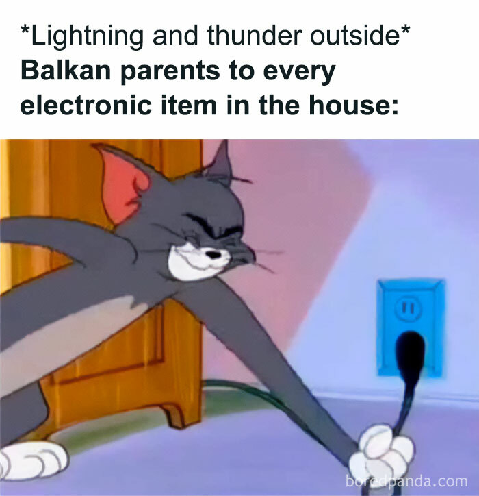 Tom cat from cartoon unplugging an electronic device during lightning and thunder, relatable meme for people raised in Eastern Europe.