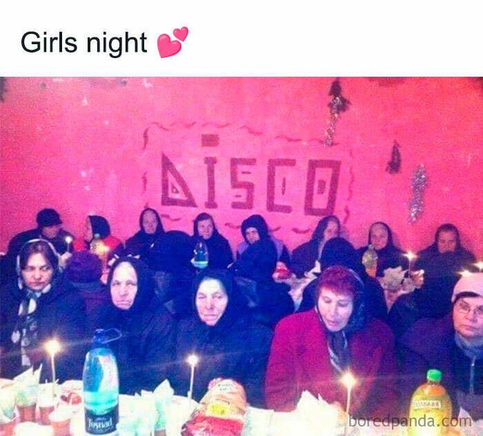 Group of older women at a dimly lit party with candles, capturing Eastern Europe humor and culture in a disco setting.