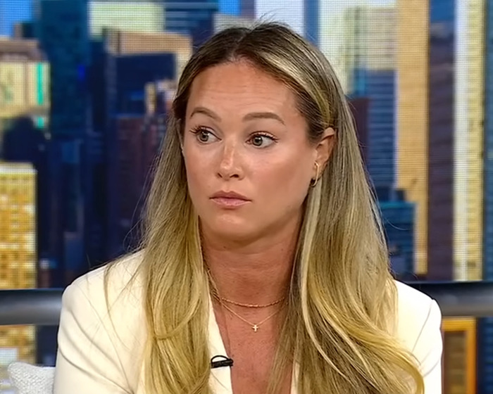 A woman with long blonde hair and a white blazer speaking about nurse suspended for calling out doctor.