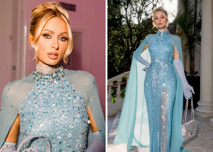 Woman in a sparkling blue gown and cape with matching gloves and handbag at a star-studded wedding event.