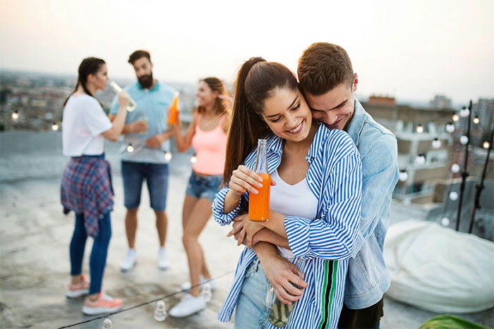 Group of young people enjoying a rooftop party, celebrating the moment they finally got even with a bully.