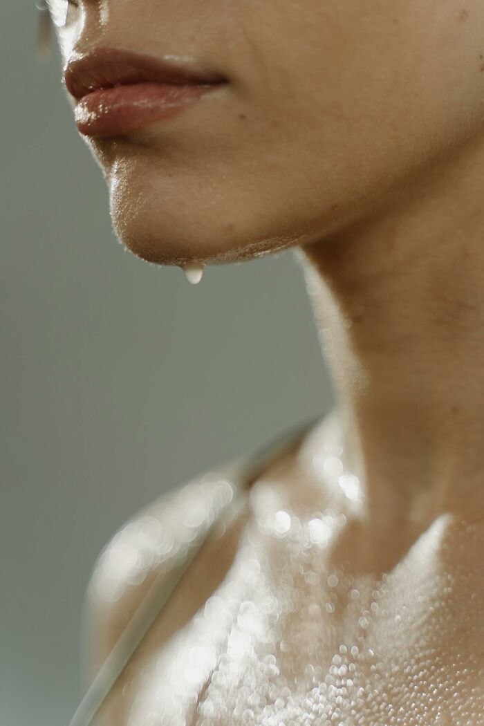 Close-up of a person’s face and neck with sweat, illustrating symptoms related to rare disease encounters by doctors.