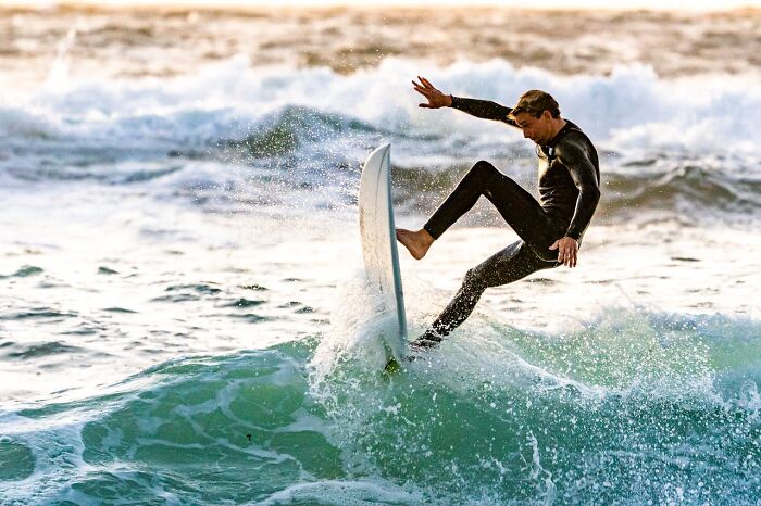 Surfer recovering from a wipeout on a wave, capturing a moment that made him say yep I’m definitely dead.