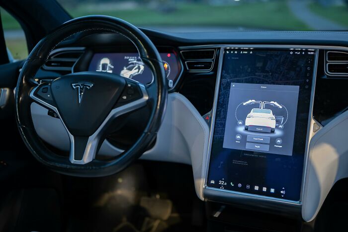 Tesla car interior with touchscreen display and steering wheel, illustrating the next big thing that totally flopped concept.