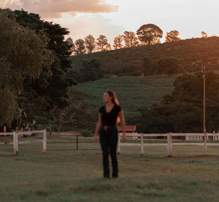 Person walking outdoors at dusk, reflecting stress and worry over potential CPS call and disapproval of dogs.