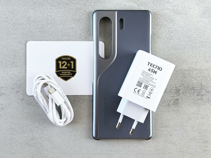 Smartphone accessories including charger, cable, and case laid out, representing overhyped products people should stop buying.