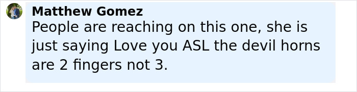 Comment explaining ASL devil horns gesture with two fingers, related to Erika Kirk's gesture during husband's funeral.