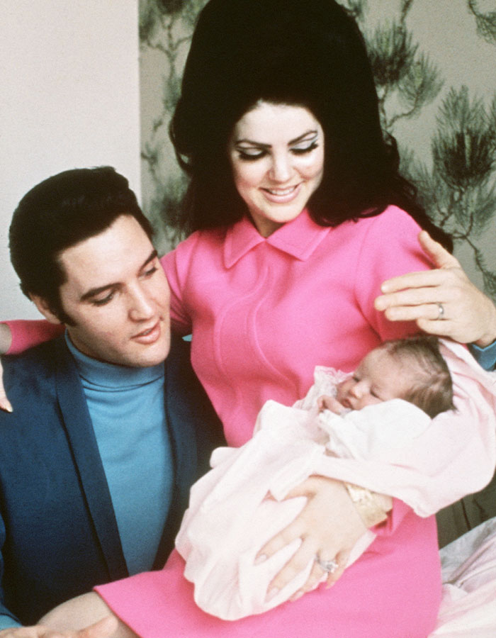 Elvis Presley and Priscilla holding baby, highlighting lawsuit revealing Lisa Marie Presley&rsquo;s heartbreaking final moments.