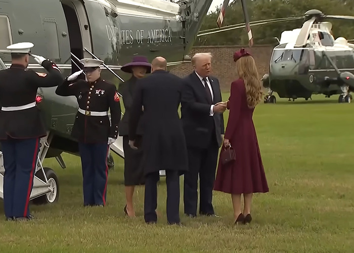 Donald Trump greeting Kate Middleton near a helicopter with Marines saluting in the background at a formal outdoor event.