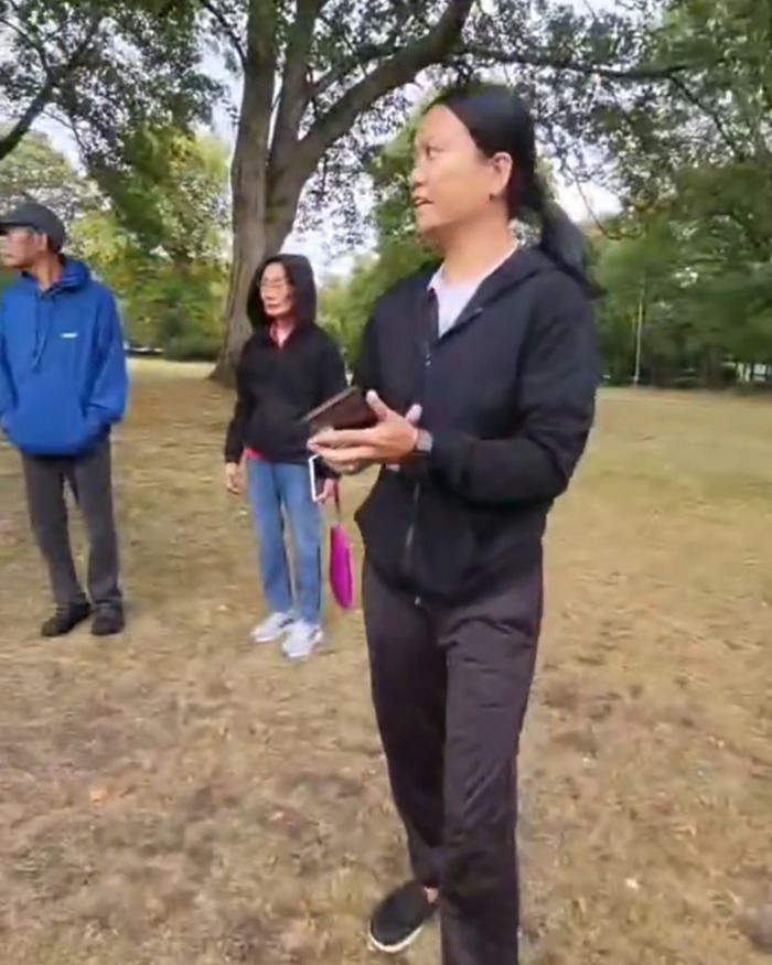 Filipino nurse and others standing in a UK park amid outrage over racial assault incident outdoors. Filipino nurse and others standing in a UK park amid outrage over racial assault incident outdoors.