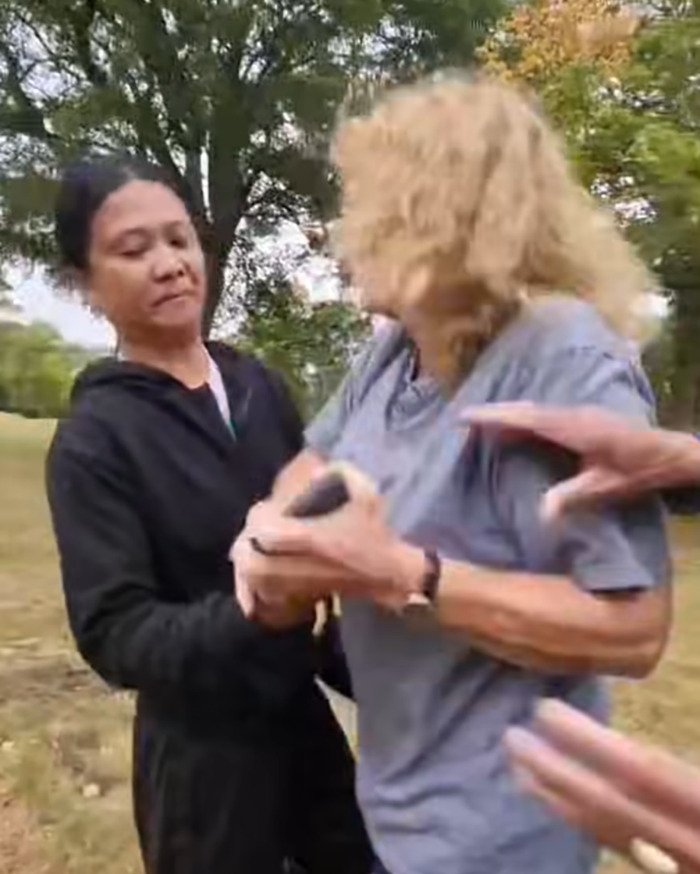 Filipino nurse confronting a woman during a racial assault incident in a UK park sparking massive public outrage. Filipino nurse confronting a woman during a racial assault incident in a UK park sparking massive public outrage.