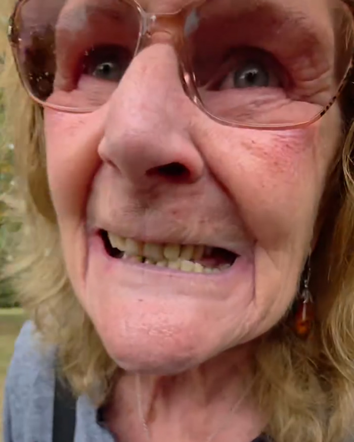Close-up of an elderly woman with glasses, related to racial assault against Filipino nurse in UK park controversy. Close-up of an elderly woman with glasses, related to racial assault against Filipino nurse in UK park controversy.