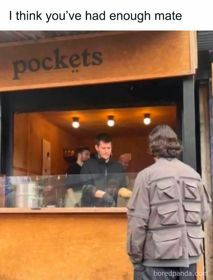 Person in a jacket with many pockets standing at a food stall, a meme from a random and viral memes collection.