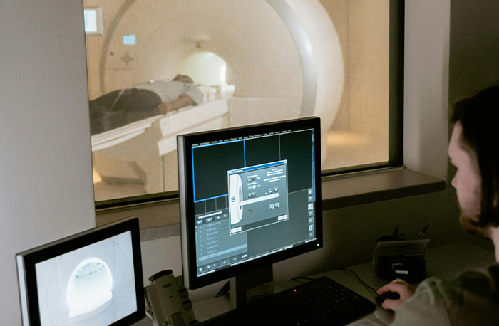 Medical technician monitoring MRI scan, illustrating doctors breaking down accurate and least accurate diagnoses from House M.D.