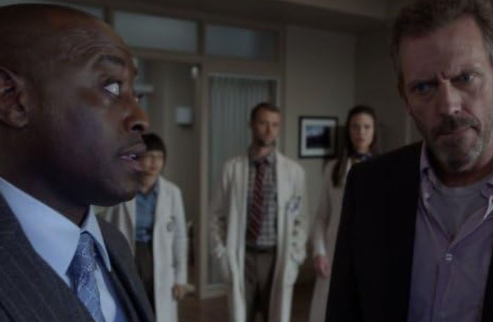 Doctors in hospital hallway discussing medical cases, illustrating accurate and inaccurate diagnoses from House M.D.