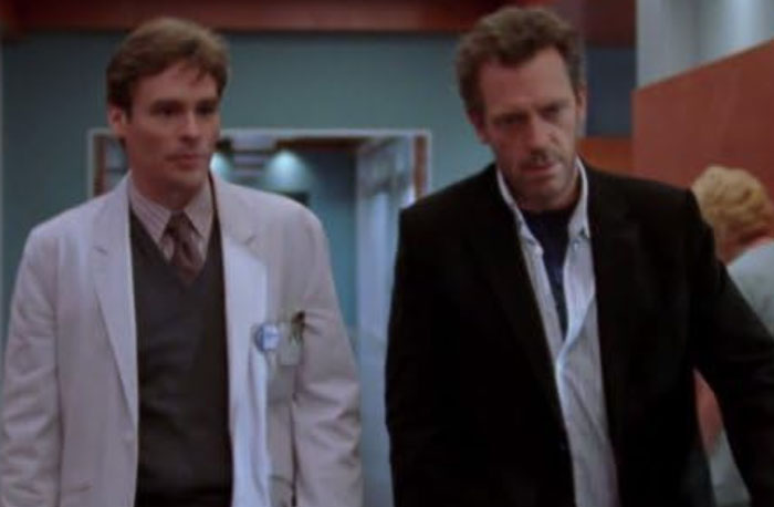Two doctors walking down a hospital corridor, representing accurate and inaccurate diagnoses in House M.D. discussions.
