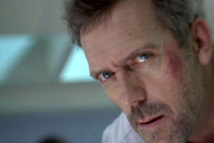Close-up of man with bruised face and intense expression, illustrating medical diagnosis accuracy in House MD.