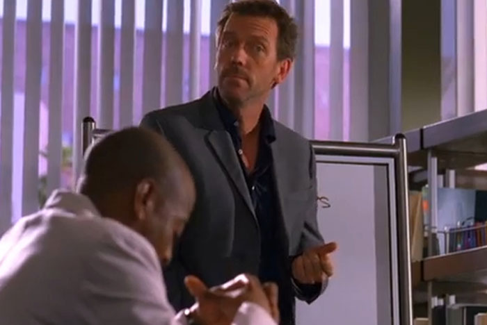 Scene from House M.D. featuring doctors discussing the accuracy of medical diagnoses in a clinical setting.