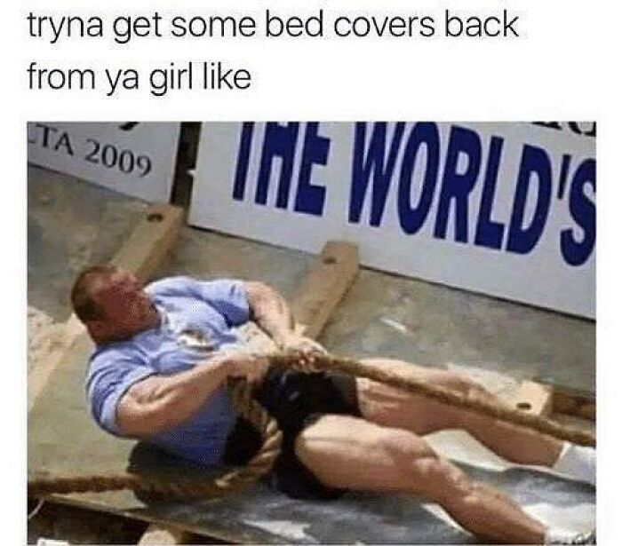 Man struggling in a tug of war, humorously depicting a relatable couple thing about trying to get bed covers back from a partner.