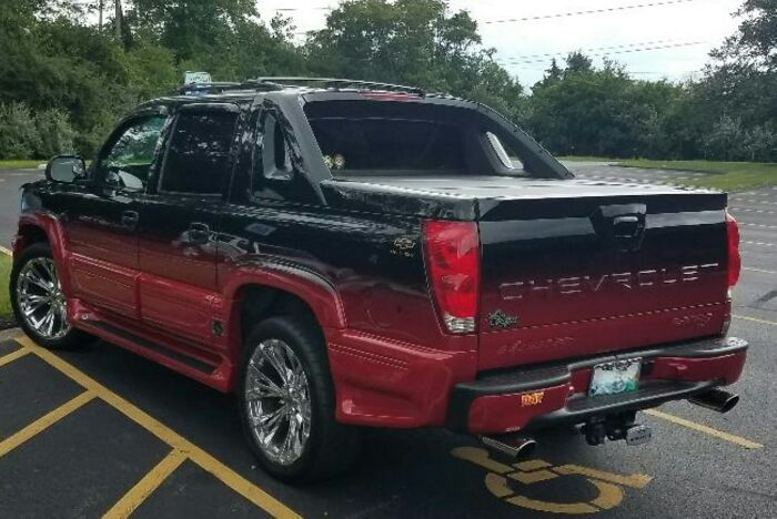 Black and red Chevrolet pickup truck parked in a lot, illustrating patients who defied medical odds according to doctors.