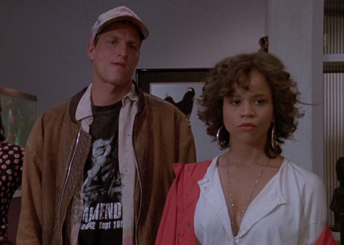 Rosie Perez and Woody Harrelson on set, discussing filming an intimate scene and body comments during production.