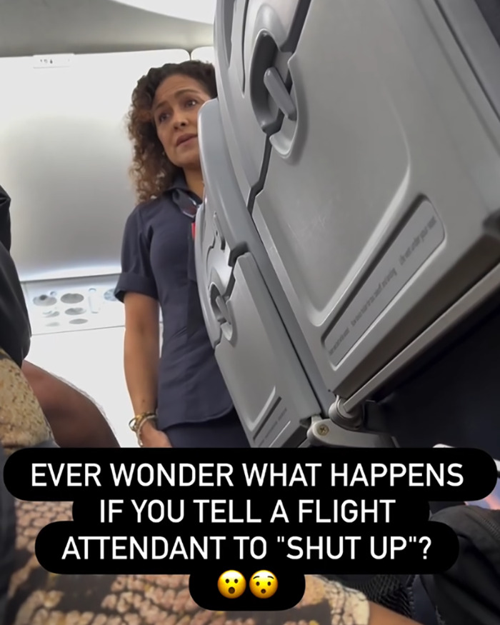 Flight attendant standing near airplane seats as entitled passenger goes viral for being kicked off flight. Flight attendant standing near airplane seats as entitled passenger goes viral for being kicked off flight.